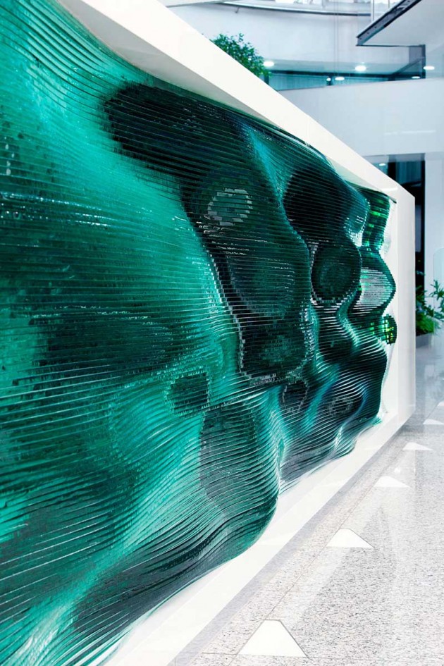 Glass Layers Make Up This Wavy Reception Desk By Tamas Abel