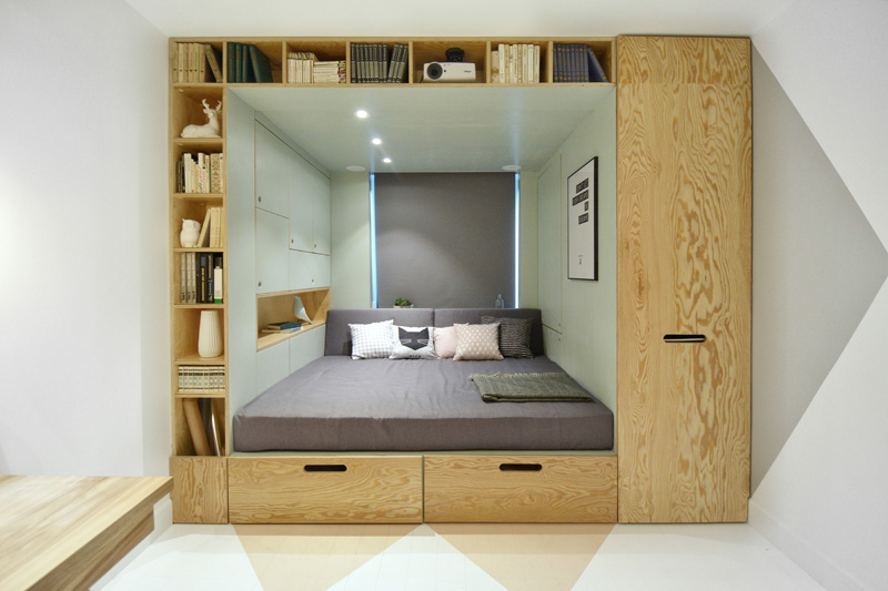 this teenager's bedroom has a built-in bed and storage for almost