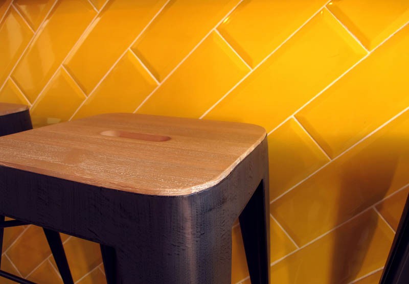 Diagonal beveled tiles in lemon yellow