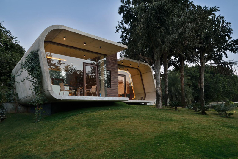 This pool house was built with a curved concrete shell