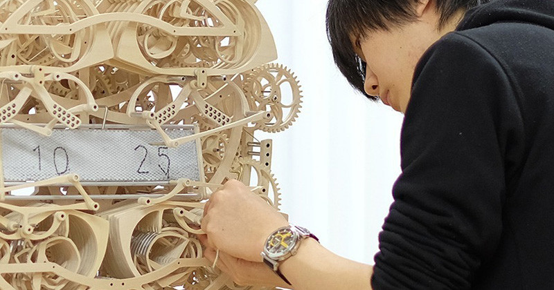 This Intricate Wood Clock Literally Writes The Time