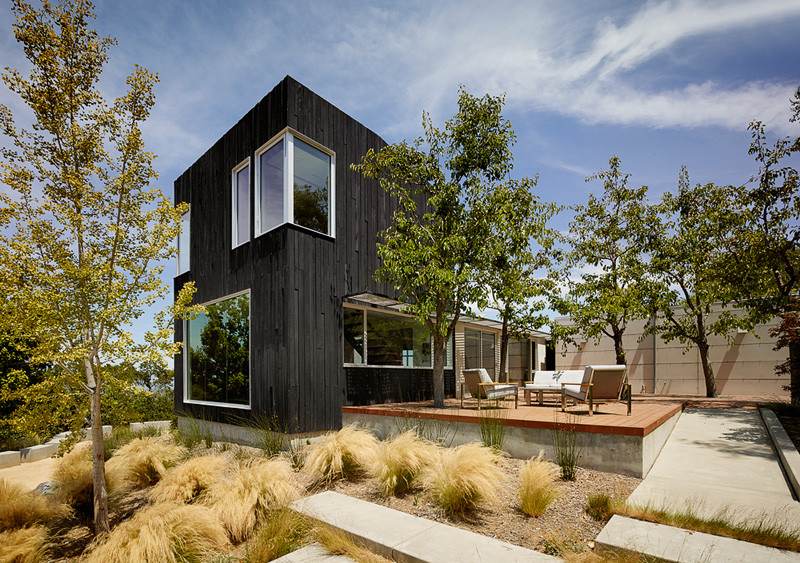 The new addition to this house in California is clad In Shou Sugi Ban siding
