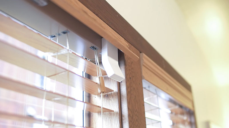 This awesome little device turns normal window blinds into smart blinds