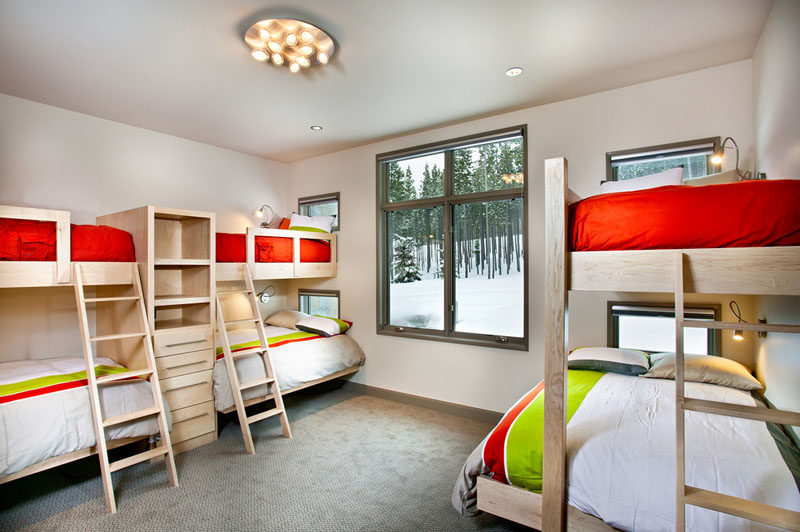 Interior Design Ideas For Sleeping Six People In A Room // This ski home designed by New Mood Design, has a bedroom with 6 built-in beds, perfect for sleepovers on the slopes.