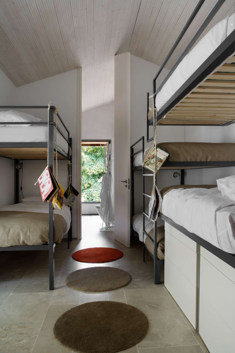 Interior Design Ideas For Sleeping Six People In A Room // These standalone bunk beds can be found in an old converted Spanish stable designed by Abaton Architects.