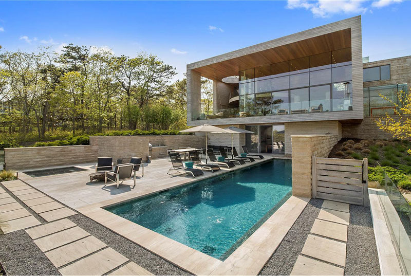 This home, designed by Barnes Coy Architects, sits on 1.5+ acres, and has a landscaped yard, an outdoor swimming pool and deck, perfect for entertaining.