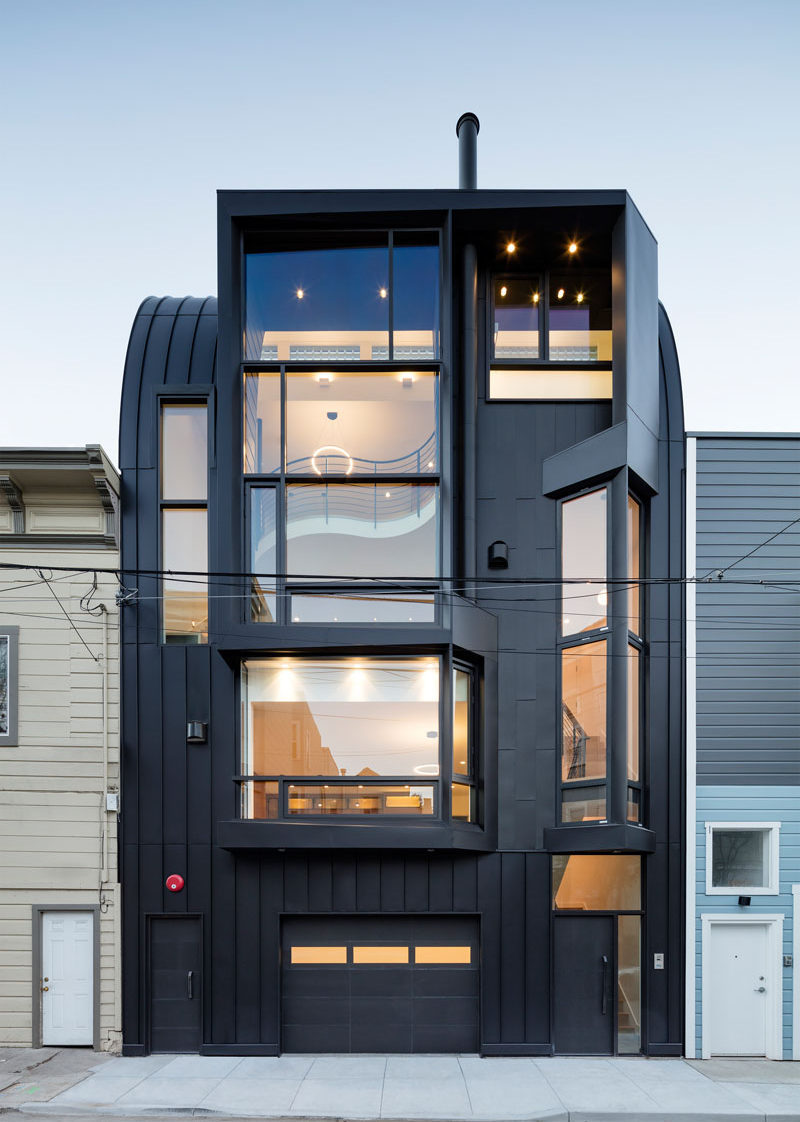 Designed by Stephen Phillips Architects, this black apartment building in San Francisco, is in a mixed-use commercial and residential district, that incorporates an eclectic group of traditional one- to four-story Victorian and Edwardian houses.