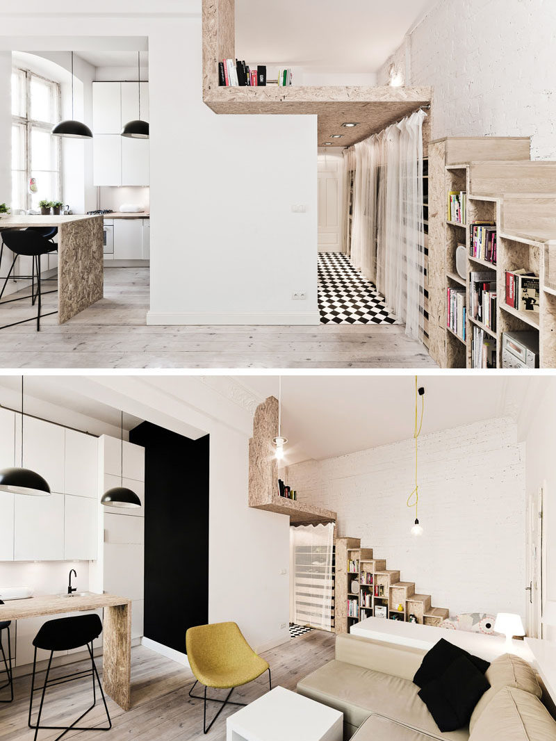 This small apartment is just 312 square feet, and it includes a lofted bedroom, stairs with storage and a well-designed kitchen that makes use of the height of the apartment.