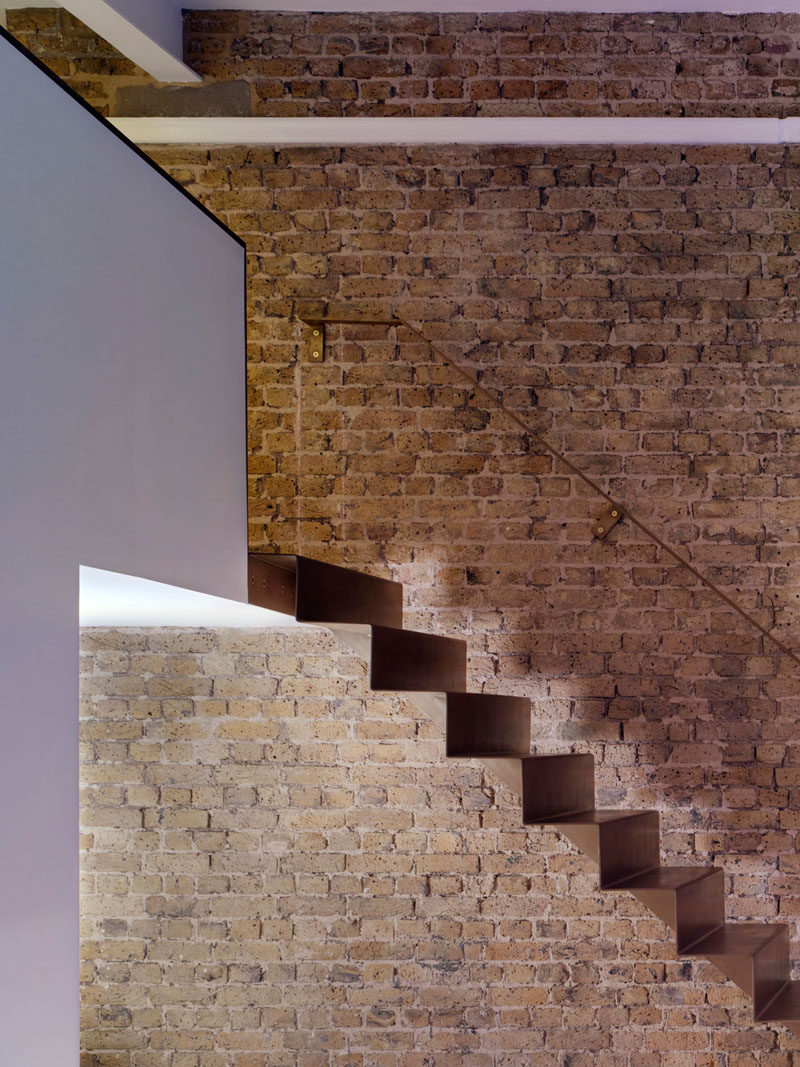 As part of the refurbishment of an apartment in Hackney, North London, Bell Phillips Architects designed minimalist stairs made from 6mm thick folded steel.