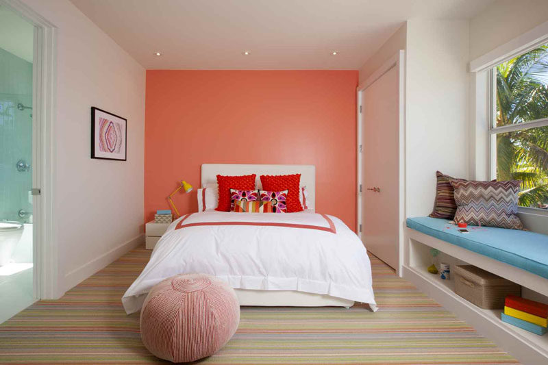 7 Examples Of Striped Floors In Contemporary Homes // The colors of the stripes in this carpet amp up the brightness and the playfulness in this colorful bedroom.