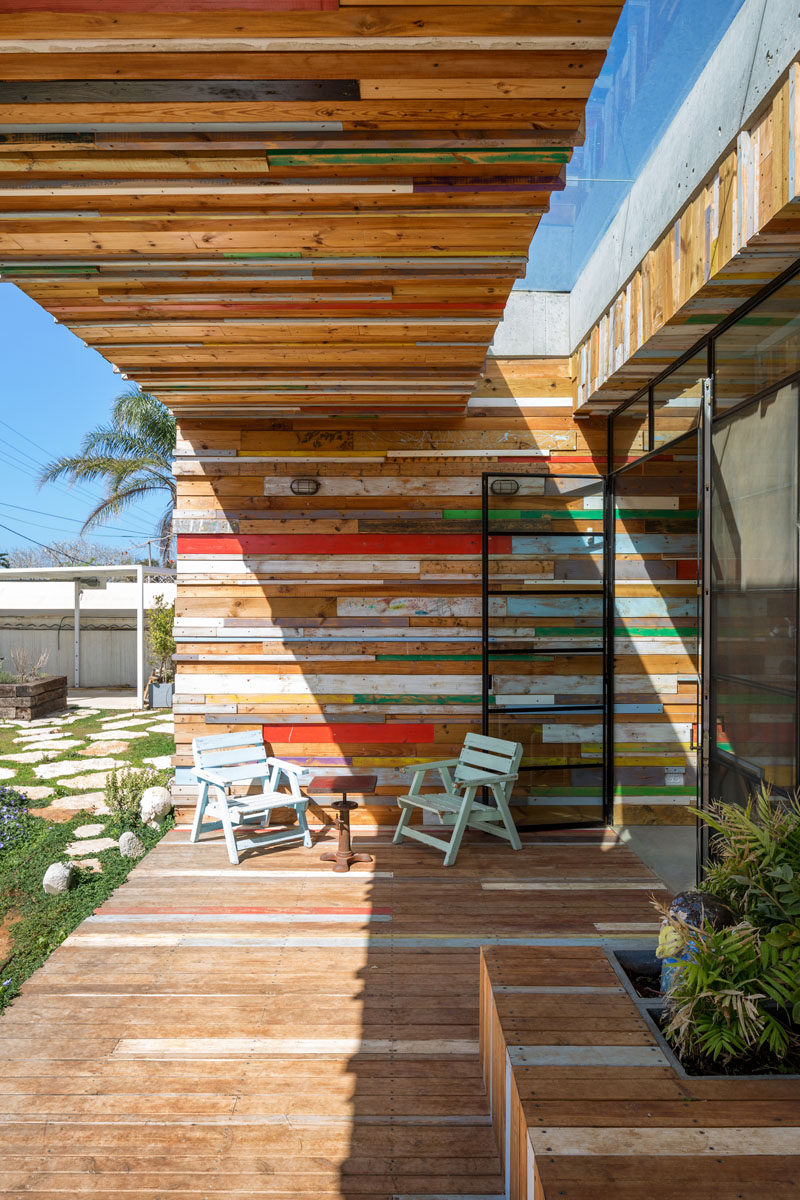 This fun outdoor patio area of a home in Israel, is covered in scrap wood.