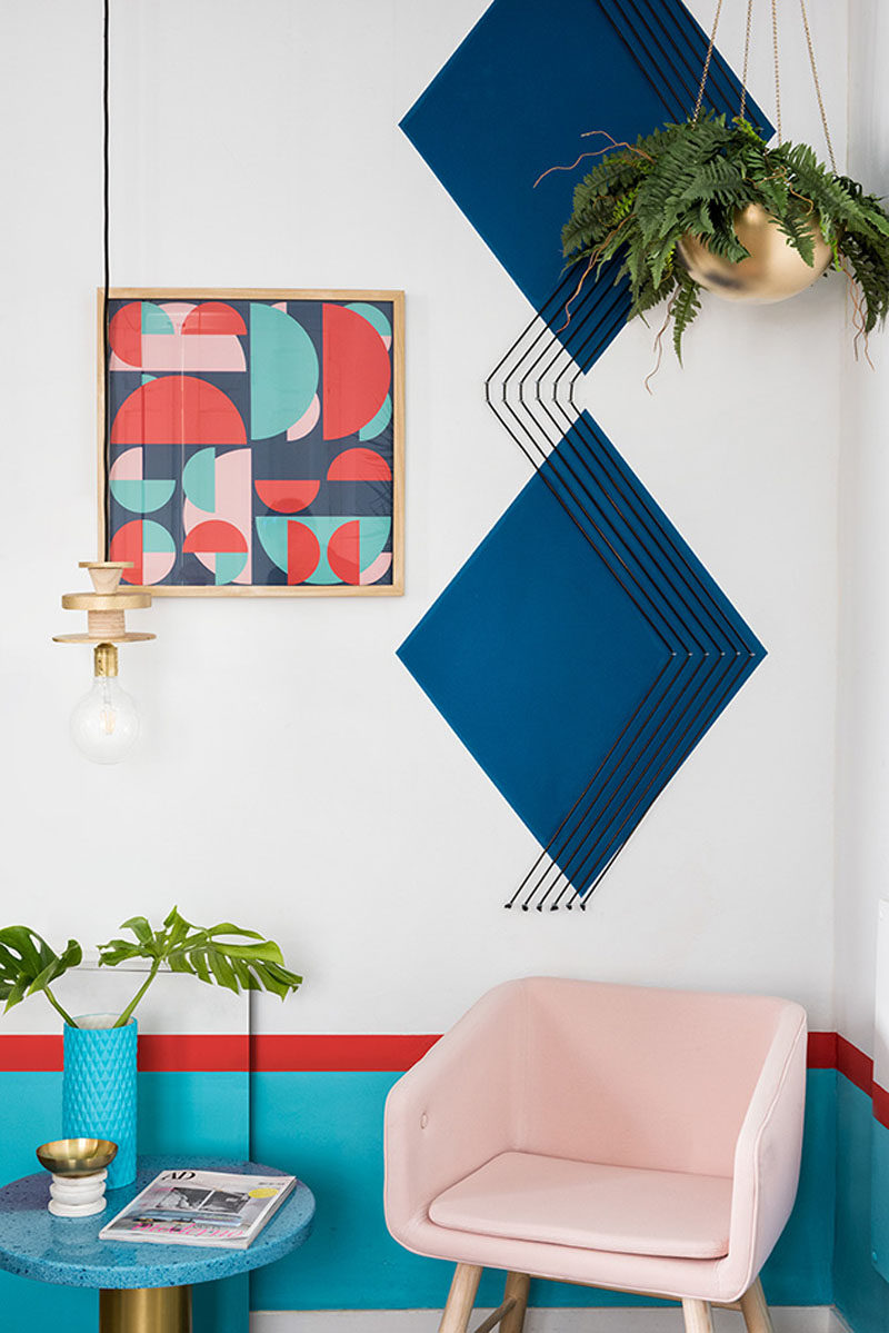 Wall Decor Inspiration - Bold Graphics Cover The Walls Of This Spanish Hostel // Large dark blue diamonds and graphic artwork liven this corner up.
