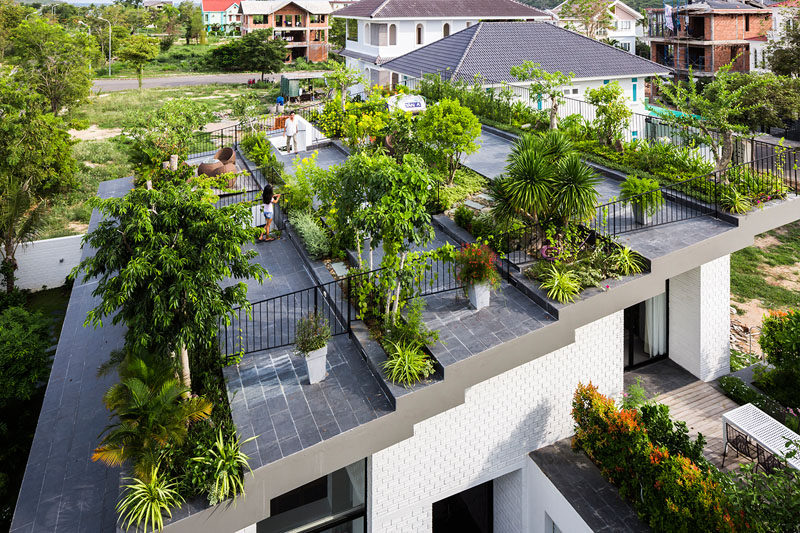When the owners of this house requested a house with a large garden, the architects responded by designing a house with a terraced roof, filled with plants.