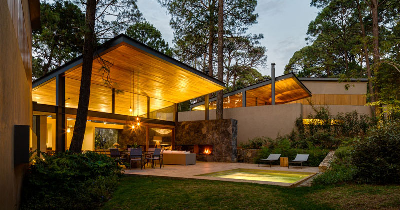 This new home of wood and stone was designed to enjoy the tranquility of the surrounding forest