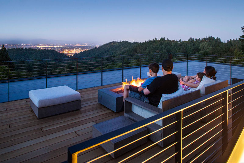 When this family wants some quiet time, they can retreat to the rooftop deck and sit by the outdoor fire.