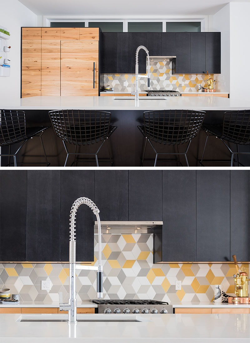 9 Inspirational Pictures Of Kitchens With Geometric Tiles // Yellow, grey, and white diamond shaped tiles create hexagons and make for a fun backsplash in the kitchen of this apartment in Calgary.
