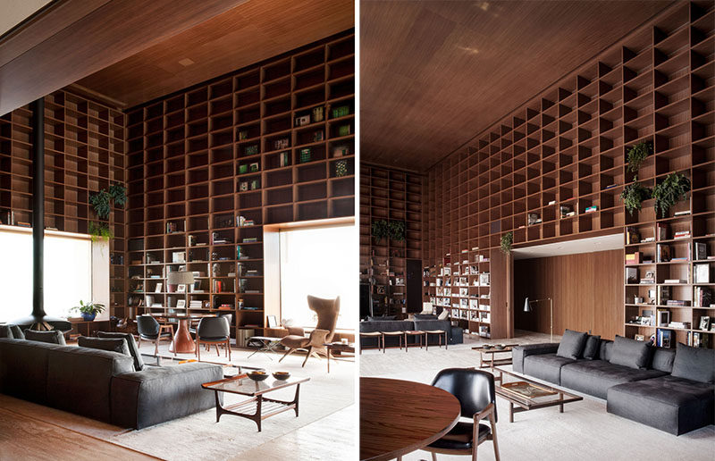 Studio mk27 design a double height room with floor-to-ceiling wooden shelves