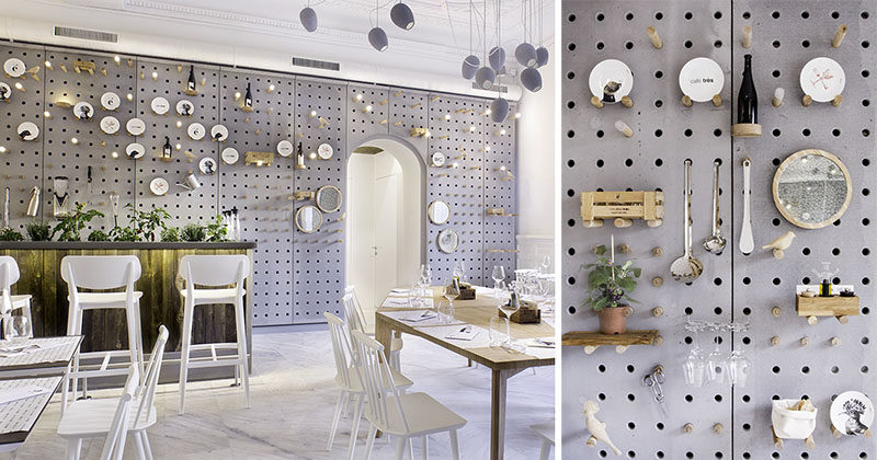 A concrete pegboard lines the wall of this cafe for a unique shelving solution