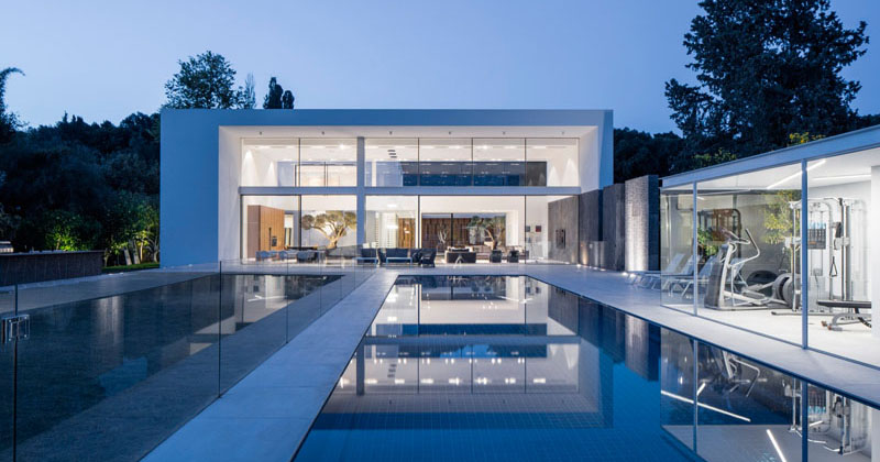 This minimalist home of double height ceilings and large windows is