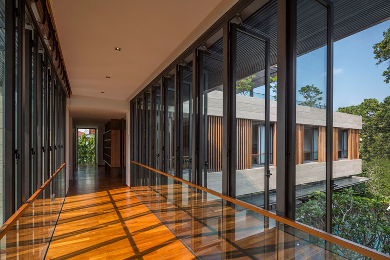 This linkway, which connects two sections of the home, is lined with windows that can be opened to facilitate airflow.