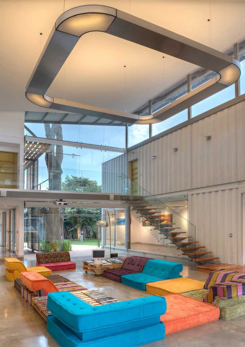 This double-height living room is inside a shipping container home in Costa Rica.