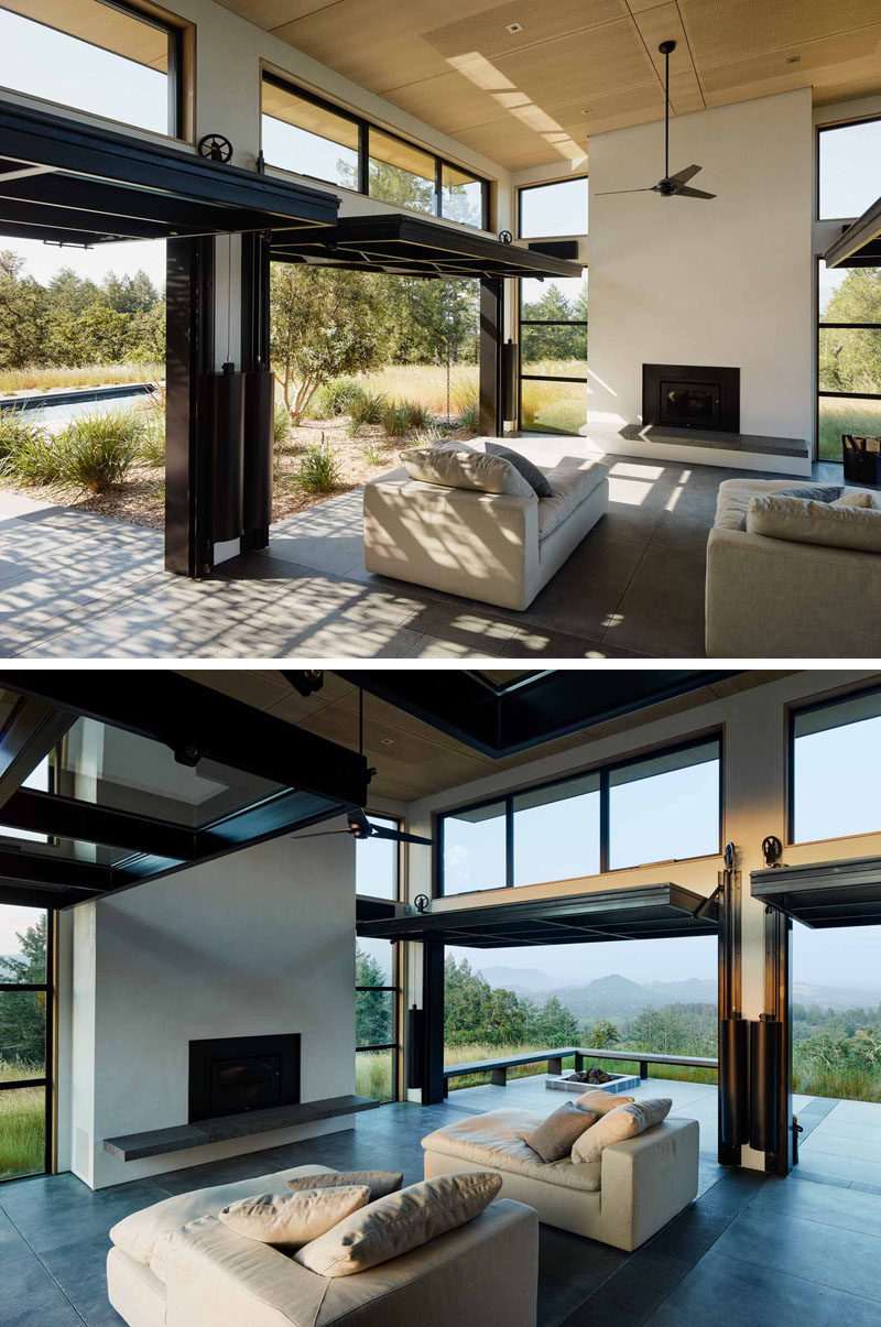 Four oversized glass panels open on a pulley system on each side of this main living room, to create a dramatic effect and allow for indoor/outdoor living, as well as assisting with air flow on a hot day.