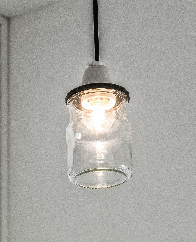 Interior Design Details - Industrial Close Ups // This small pendant light, made from a glass jar and a concrete top, brightens the space and contributes to an overall industrial vibe.
