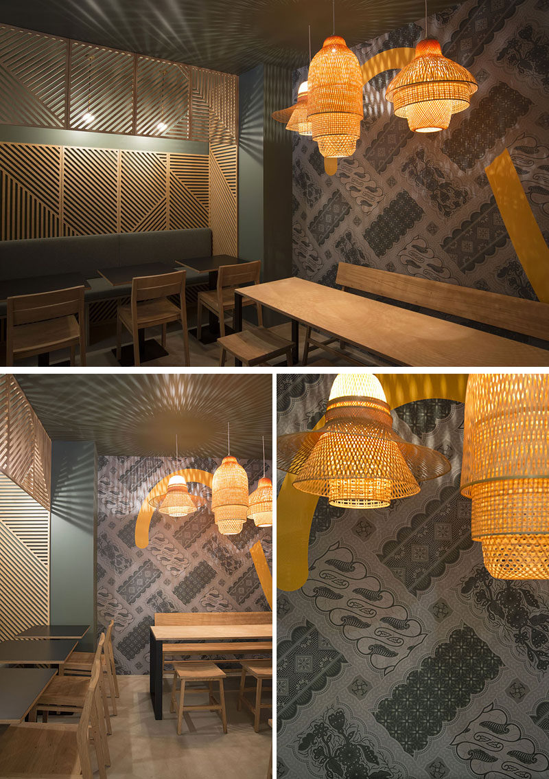 In this contemporary restaurant, the shadows from the lights behind the wooden wall panels and the pendant lights, make for a unique shadow pattern on the ceiling and walls.