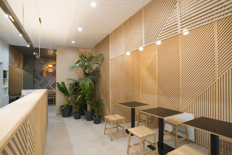 Wall Decor Idea - This restaurant covered its walls with wood panels that look like abstract line art