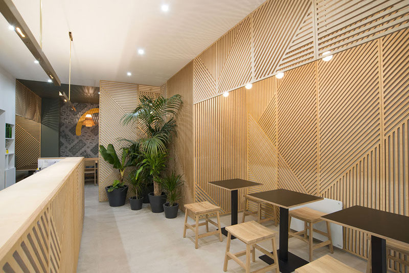 Wall Decor Idea ? This restaurant covered its walls with wood panels that look like abstract line art