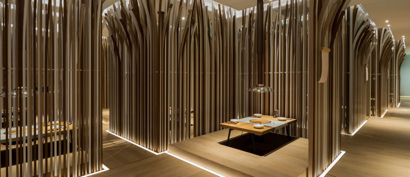 The Tables In This Restaurant Are Surrounded By A Forest Of Curved Wooden Strips