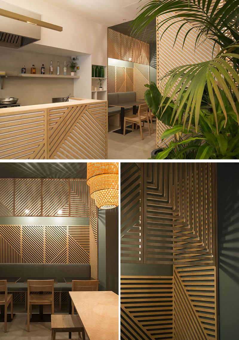 Wooden wall decor creates an interesting look for this modern restaurant in Paris.