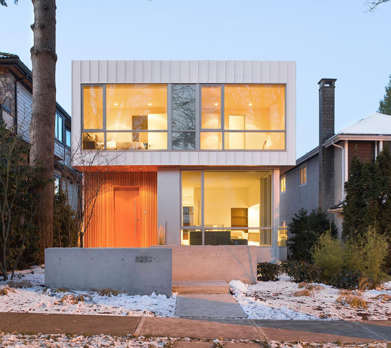 This new modern house in Vancouver is filled with light from the large windows facing the street