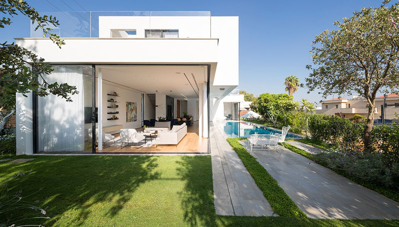 Large sliding glass walls give this house easy access to the pool