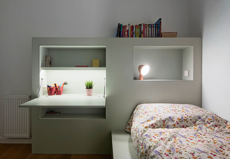 This Small Kids Bedroom Combines The Bed Frame, A Desk, And Shelves To Save Space