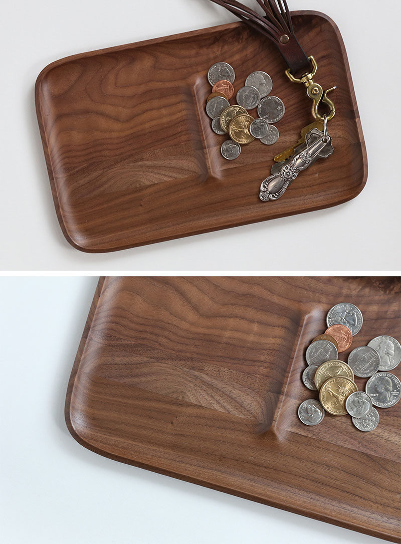 This large walnut tray features a ridge in the middle to create two sections that make it easier to keep things separate and organized.