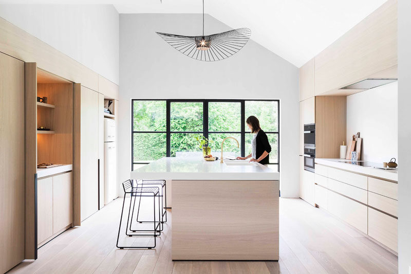 Light Wood And White Countertops Create A Neutral Softness In This Kitchen