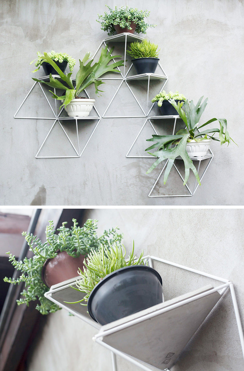 This modular wall planter system can be used inside or out and allows you to create a garden of whatever size you want, and adds a geometric touch wherever you hang it. #WallMountedPlanters #WallPlanters #Decor #HomeDecor #Plants #Gardening