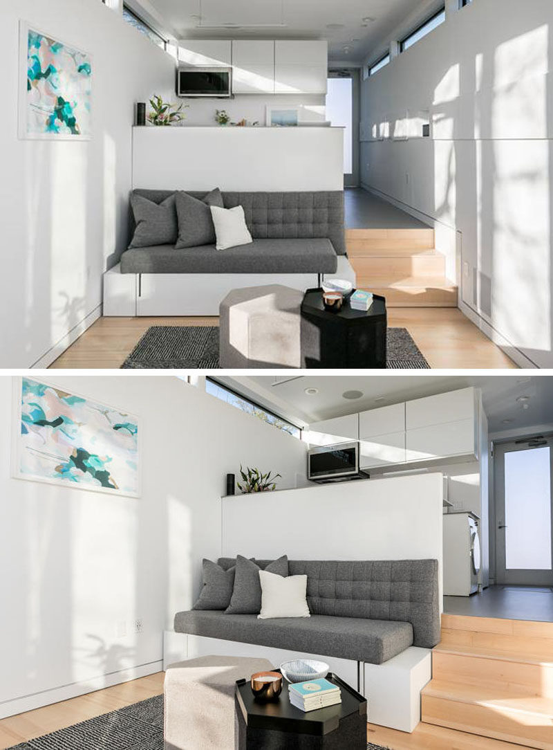 This tiny house has a ceiling height of just over 10 feet, and a custom designed couch fits the space perfectly and hides a bed.