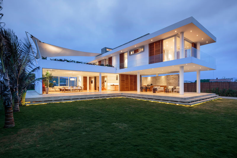 Gabriel Rivera Arquitectos have designed a modern beach house in Puerto Cayo, Ecuador, that has interiors that open up to enjoy the breeze of the water.