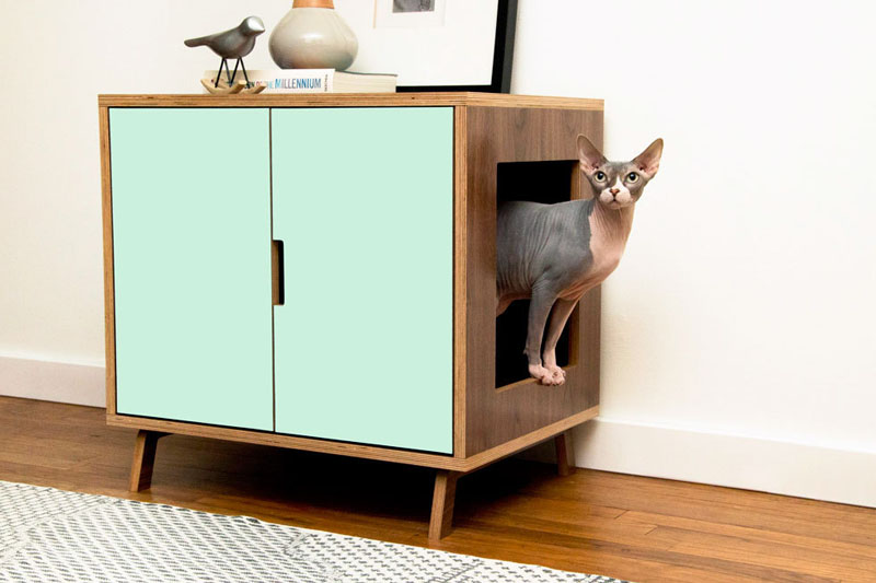 This modern cabinet hides a litter box inside, and is made from a high quality walnut wood with a water proof finish, which can be left natural or painted.