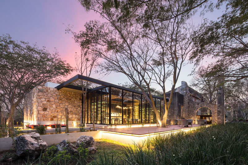 This modern restaurant in Mexico, with plenty of glass and wood, has been built inside a 19th century engine house of a farm that was in disrepair.