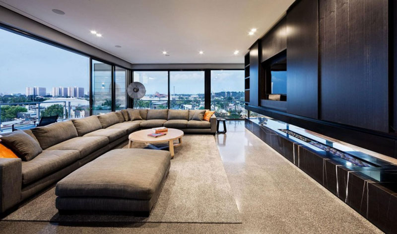 This modern penthouse is decorated in hues of blacks and greys, and has plenty of space for entertaining.