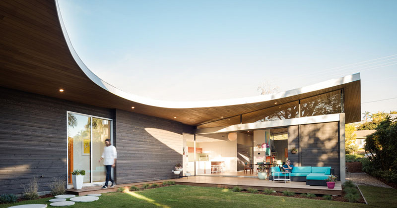 The Avocado Acres House In California Features A Roof That Curves Around The Backyard