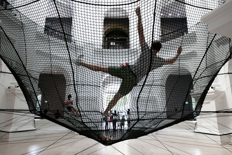 Atelier YokYok have installed a large net within the National Museum of Singapore, that's designed as an inverted dome and allows for visitor interaction.