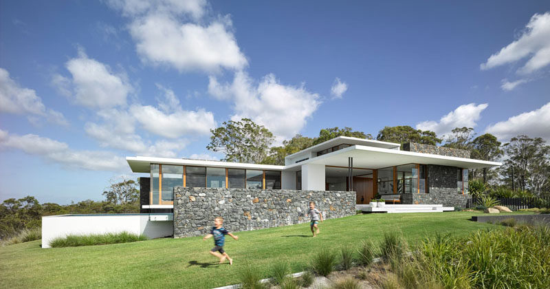 Australian architecture firm Base Architecture, have designed a modern family home in Queensland, that opens up to the surrounding outdoor spaces.