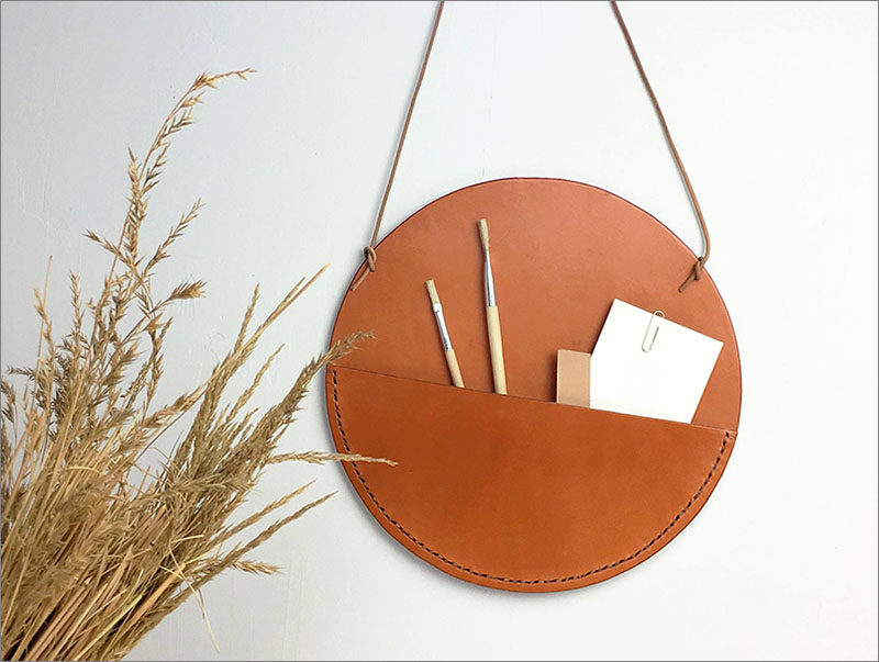 Javier Prieto Martínez of Miolos Design, has created a collection of leather pockets that hang on your wall, that are designed as an alternative to shelves.