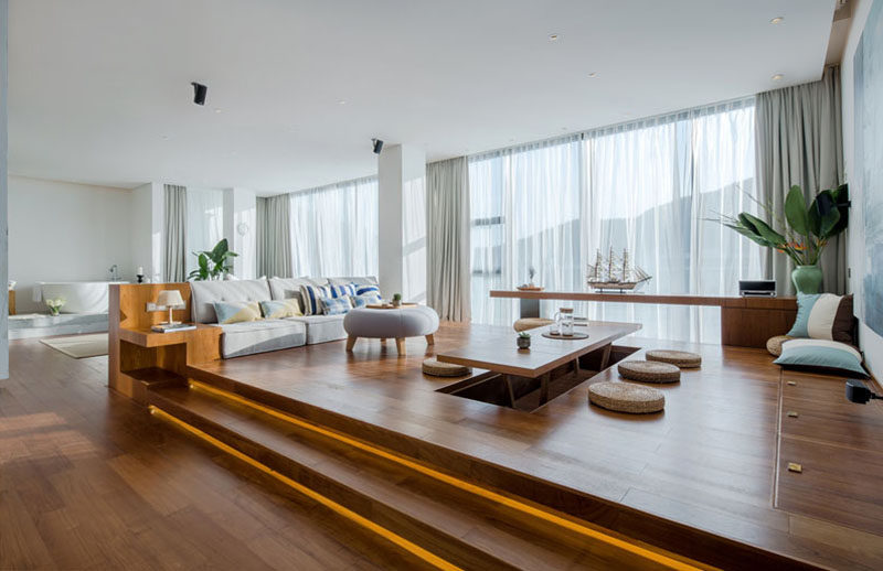 Raised Platforms Help To Make This Open Plan Apartment Feel Like It Has Different Rooms