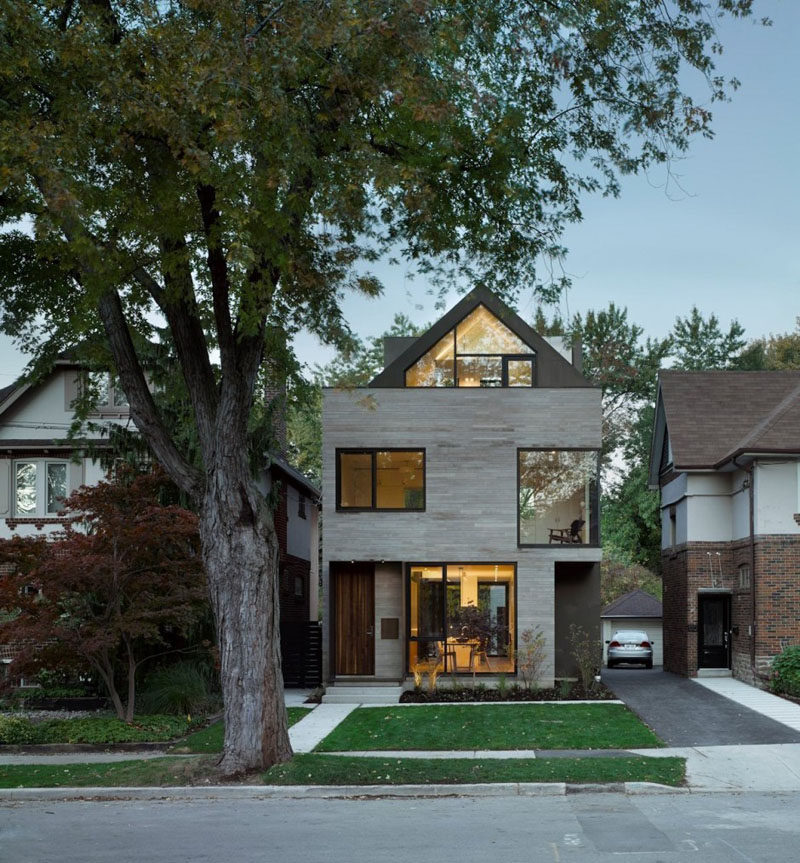 Drew Mandel Architects have designed a modern infill house in Toronto, Canada, that sits between 1920s-era single-family homes. #ModernArchitecture #ModernHouse