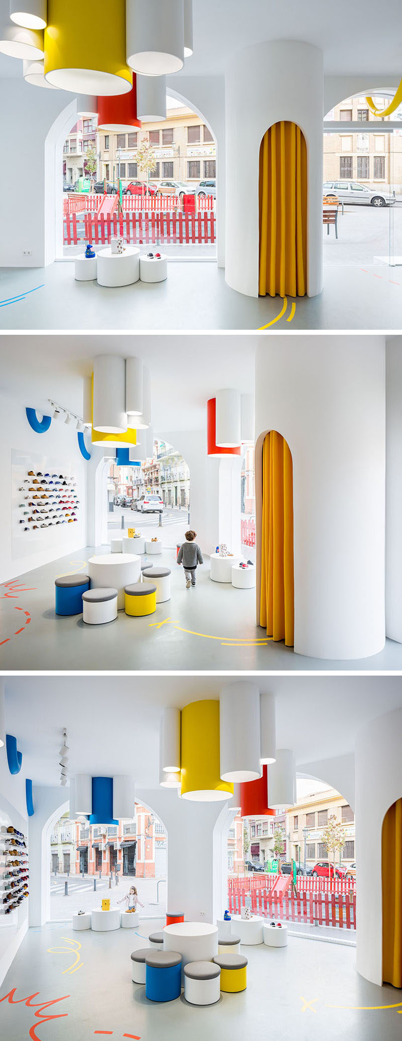 Once inside this modern retail store, the bright white interior is filled with natural light from the large windows, and additional tube lights hang from the ceiling. Pops of color are used to add a fun touch to the interior. #ModernRetailStore #KidsStore #InteriorDesign